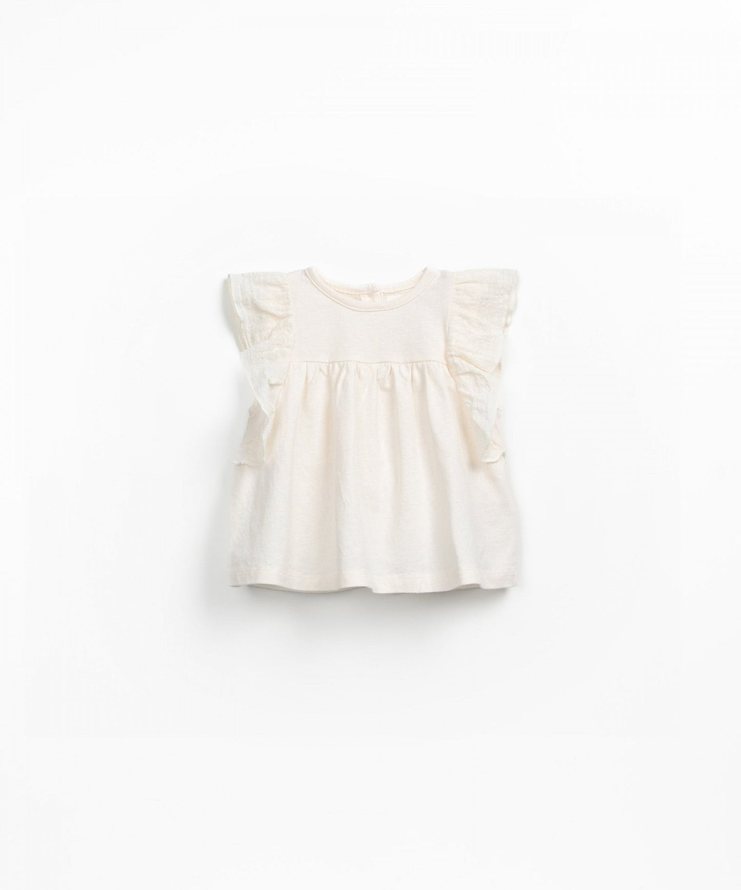 Blusa smanicata con volant